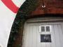 Winston Churchill photograph and St. George's flag outside the Coach & Horses pub, Wythall.