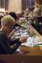 Under close supervision of party workers, volunteers sort, verify and count the votes in Rochdale Town Hall.