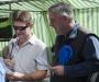 Oliver Heald explains the leaflet - that he is holding upside down. Letchworth Farmers Market