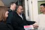 Three Labour candidates for St Katherine’s & Wapping ward - Denise Jones, Michael Keith and Shafiqual Haque - greet a voter on his doorstep. London.