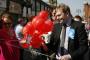 Anthony Calvert, Conservative PPC for Morley and Outwood, does a walkabout with campaign staff in Morley during the St George’s Day festival. He's pictured taking a Labour branded balloon off of one of Ed Balls' campaign team who were also in Morley. Saturday 17th April.