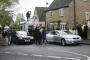 Leader of the Conservative Party David Cameron and his wife Samantha leave the Polling Station at the Memorial hall in Spelsbury, Oxfordshire. You can also spot Simon Roberts, the election artist, on the roof of his motorhome in the background. 6 May 2010