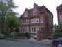 A semi-detached house in St Margaret’s Road, Oxford, displaying a variety of election posters.