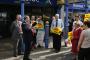 John Prescott waves his Labour party membership card at local party supporters in the centre of Tamworth.