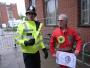 Lord Biro - also known as Dave Bishop - questioned by a police officer while campaigning at Birmingham University during the Leader's Debate.