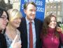 Peter Mandelson had just spoken to Sky News on College Green (06/04/2010). These people asked for a photo with him. Placard man in the background was trying to get into TV shot all day, pity he got into this shot.