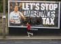 Jogging past Cameron. Vandalised poster. North Leeds.