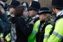 A man confronts police blocking Pero's Bridge in Bristol, a few minutes before the Leaders' Debate begins in the Arnolfini arts centre on its far side.