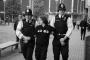 A man is led away by police after a confrontation on Pero's Bridge, Bristol, minutes before the start of the Leaders' Debate.