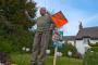 Old Ken Voisey canvassing for the Liberal Democrats outside his house in the village of Ide, Devon.