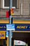 An over-crowded lapmp post on a major oad junction in Dewsbury.  Within 24 the lamp-posts on the ring road in the town went from having no signs to being adorned with various faces of PPC's and also local councillors.