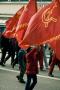 Trade Union march through Derby May 1st. A girl holds up a communist party flag